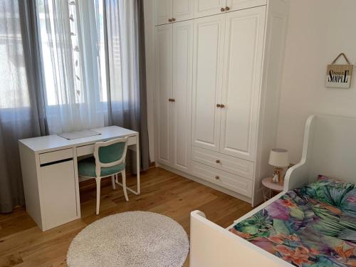 a bedroom with a desk and a bed at Alex Apartments in Budva