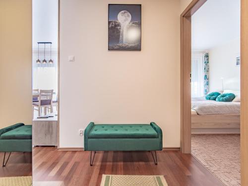 Posteľ alebo postele v izbe v ubytovaní Moya Bay Apartament