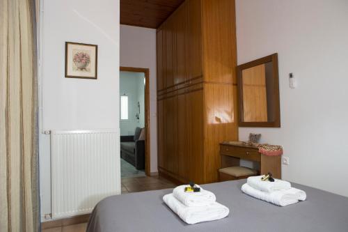 a hotel room with two towels on a bed at Chrysa House Kissamos in Kissamos