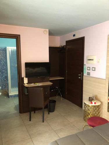 an office with a desk and a computer in a room at Villa Camilla Milano in Milan
