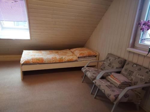 En eller flere senger på et rom på Chalupa Miška
