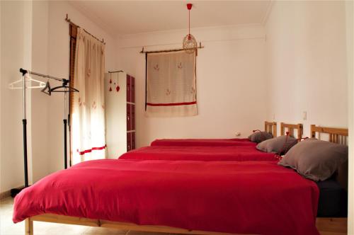 Katil atau katil-katil dalam bilik di Casa del viajero
