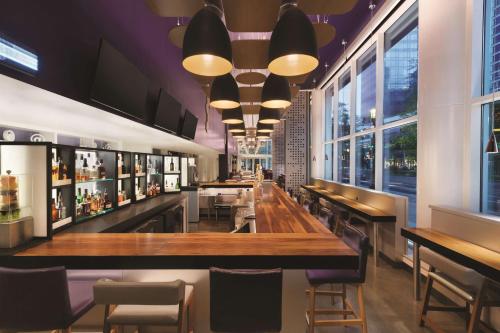 a large dining room with a large window at YOTEL Boston in Boston