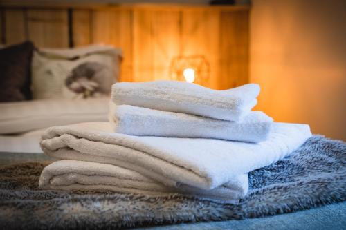 a pile of towels sitting on top of a table at Drumhierny Woodland Hideaway in Leitrim