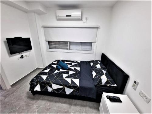 TV a/nebo společenská místnost v ubytování Diamond Suites Eilat