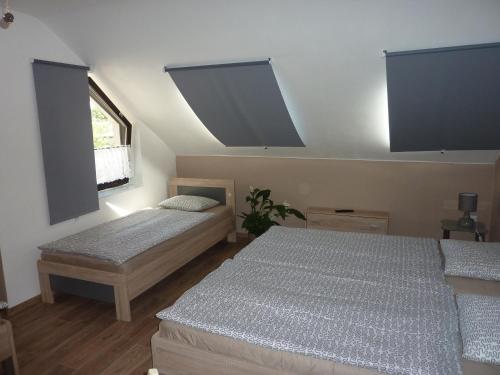 מיטה או מיטות בחדר ב-Penzion Čech