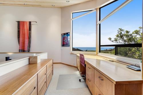 an office with a desk and a window at The Indigo in Sea Ranch