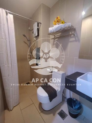 a bathroom with a toilet and a sink and a mirror at SG Resort Residences Kuantan by AP CA CON in Kampung Sungai Karang