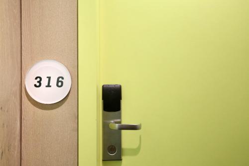 a door with the number on it at Miss Baker's Boutique Accommodation Bondi in Sydney