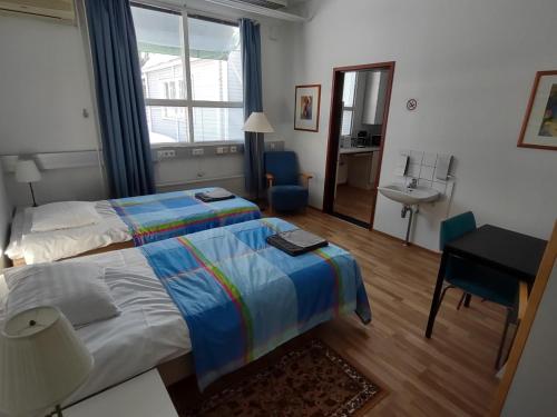 Postel nebo postele na pokoji v ubytování Hotel 24 - Karihaara - Kemi