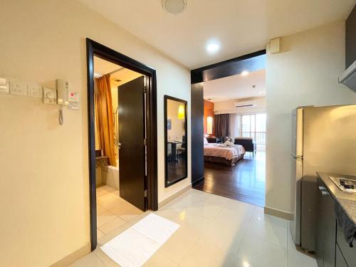 a room with a door leading to a bedroom at Sunway Resort Suites max 4 pax studio 1 mins walk to Sunway Pyramid in Petaling Jaya