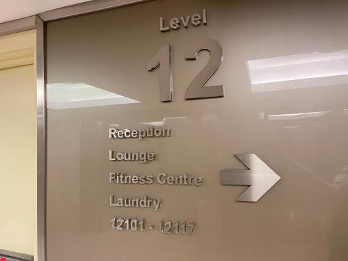a sign on the door of a building with the number twelve at Sunway Resort Suites max 4 pax studio 1 mins walk to Sunway Pyramid in Petaling Jaya
