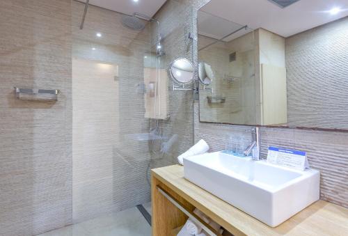 a bathroom with a sink and a shower at Marins Playa in Cala Millor
