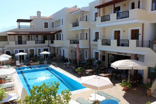 a view of a hotel with a swimming pool at Apollo City Hotel - Maliatim in Malia