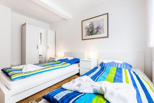 Katil atau katil-katil dalam bilik di Ferienhaus Köln