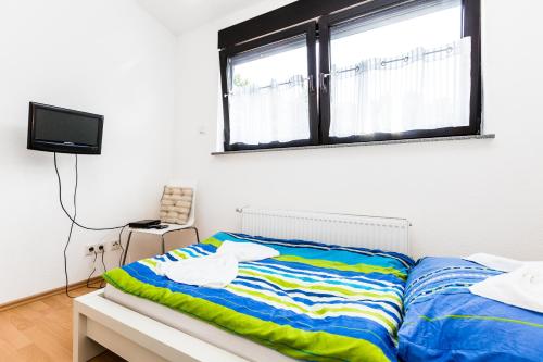Katil atau katil-katil dalam bilik di Ferienhaus Köln