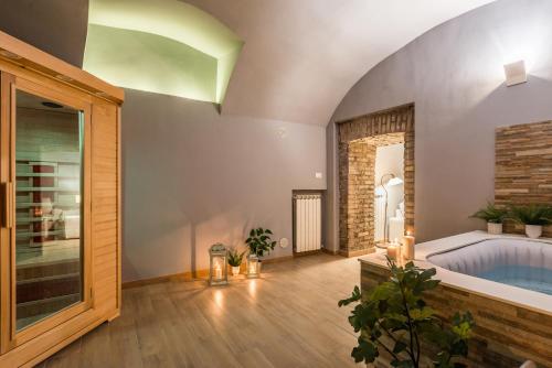 Ένα ή περισσότερα κρεβάτια σε δωμάτιο στο Piacentino Homes Campo de Fiori apartment