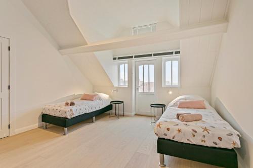 Un pat sau paturi într-o cameră la Maison Perron