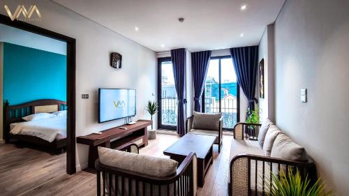 Postel nebo postele na pokoji v ubytování VNAHOMES APARTHOTEL