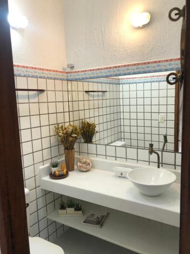 Ванна кімната в Chalé Boiçucanga - Condomínio Village do Mirante