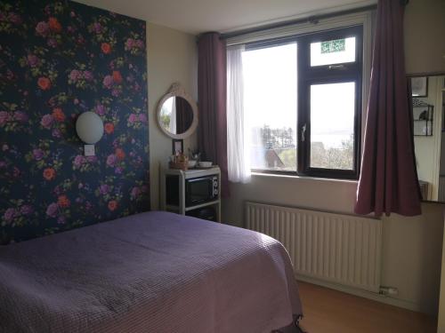 A bed or beds in a room at Rodeen Country House