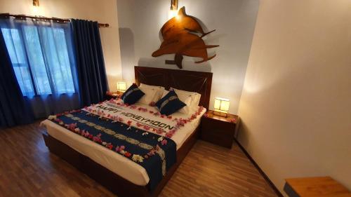 Postel nebo postele na pokoji v ubytování Blue World Dharavandhoo