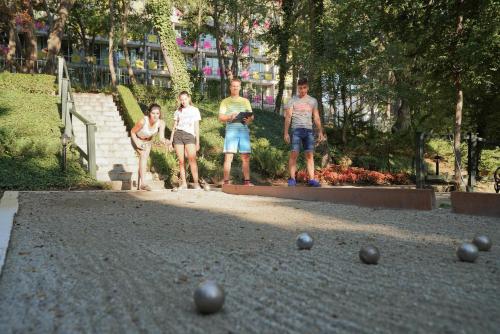 a group of people standing around balls on the ground at GRIFID Arabella Hotel - Ultra All inclusive & Aquapark in Golden Sands