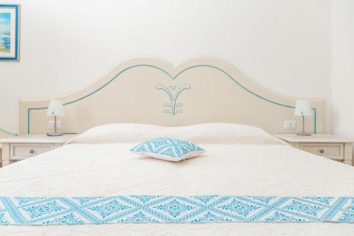 Hotel Genna 'e Masoniにあるベッド