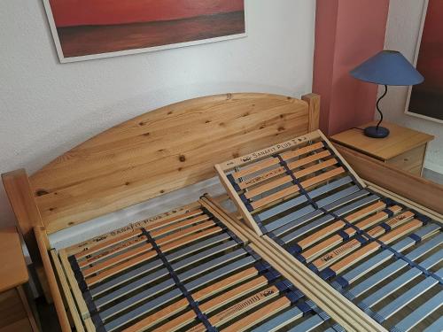a bedroom with a wooden bunk bed with a lamp at Zimmervermietung Koltermann in Greifswald
