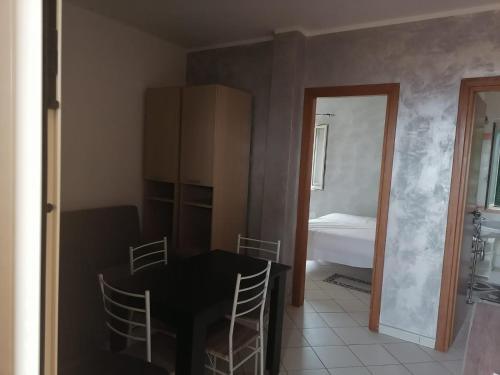 Postel nebo postele na pokoji v ubytování Bilocale RESIDENCE MARASUSA