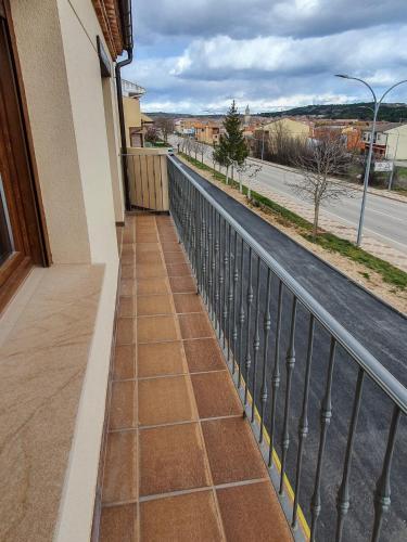 a balcony with a view of a street at DOMVS I in El Burgo de Osma