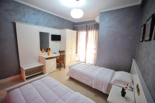 Postel nebo postele na pokoji v ubytování Iliria Internacional Hotel