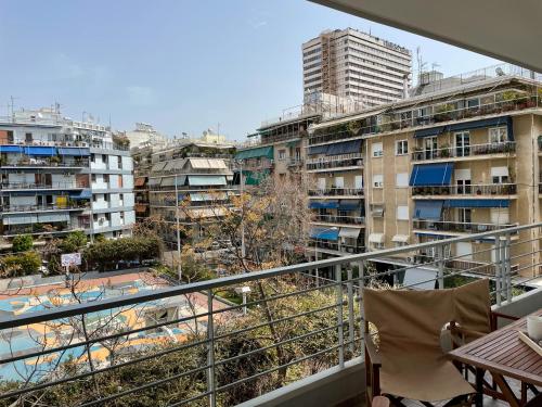 a balcony with a view of some buildings at Ageliki's Athens Apartment in Athens