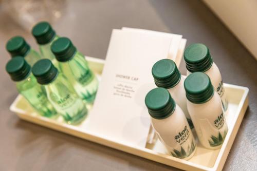 a tray with five bottles of milk on a table at Grand Hotel Park in Dubrovnik