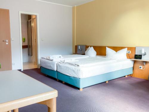 Letto o letti in una camera di Aktiv-Hotel Stock & Stein
