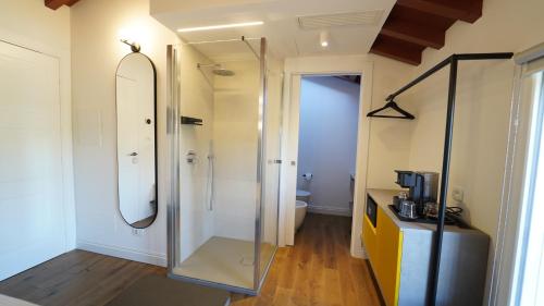 a bathroom with a shower with a glass door at Ca’ Prandini in Maranello