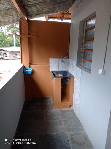 a bathroom with a sink on the side of a building at Casa Recanto in Campos do Jordão