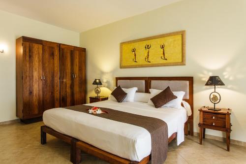 En eller flere senger på et rom på VOI Amarina Resort