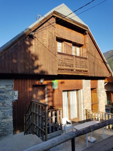 a large wooden building with a balcony on it at Chalet Le Sambuis in Saint-Colomban-des-Villards
