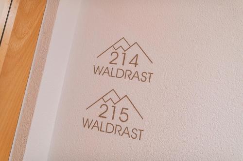 a book with the names of the waldass on it at Aparthotel Hochland GmbH in Nauders