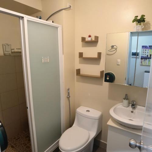 a bathroom with a toilet and a sink at Avida Davao Condos, downtown CM Recto Avenue, Davao City in Davao City