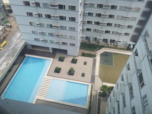 an overhead view of a building with a swimming pool at Avida Davao Condos, downtown CM Recto Avenue, Davao City in Davao City