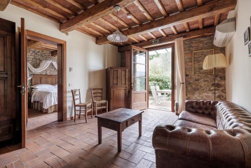 a living room with a couch and a table at B&B Hotel La Piana in Borgo a Buggiano