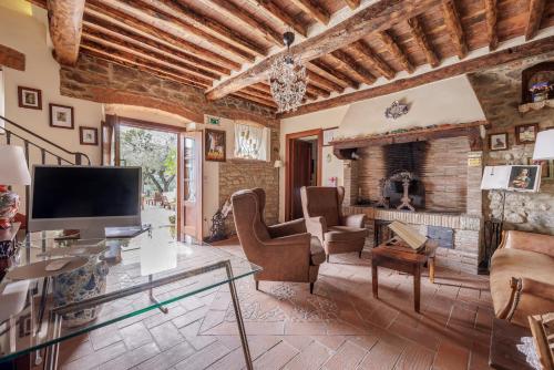 a living room with a table and a fireplace at B&B Hotel La Piana in Borgo a Buggiano