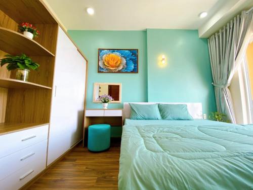 Llit o llits en una habitació de Cookies Homestay Vung Tau Gold Sea (Căn Hộ Biển)