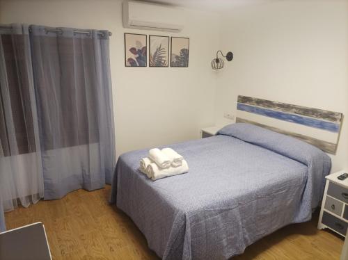 Postel nebo postele na pokoji v ubytování Casa La Piedra