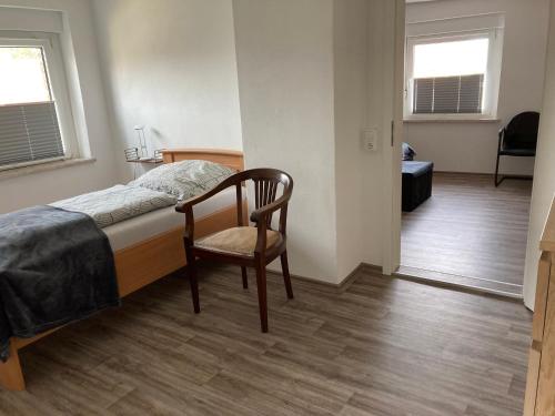 Ένα ή περισσότερα κρεβάτια σε δωμάτιο στο Gästehaus zur Bienerei