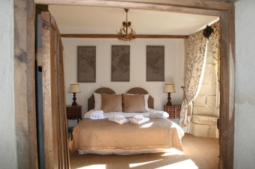 Posteľ alebo postele v izbe v ubytovaní Manoir de Kerledan