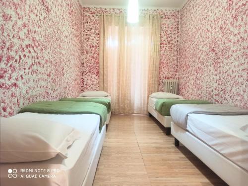 Voodi või voodid majutusasutuse Soggiorno Emanuela toas