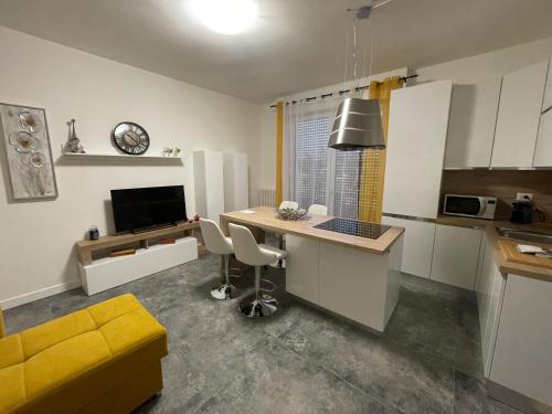 a kitchen with a desk with a computer in it at Magic Apartments in Bardolino